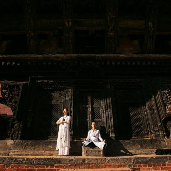 Person meditating in a serene environment, embodying peace of mind.